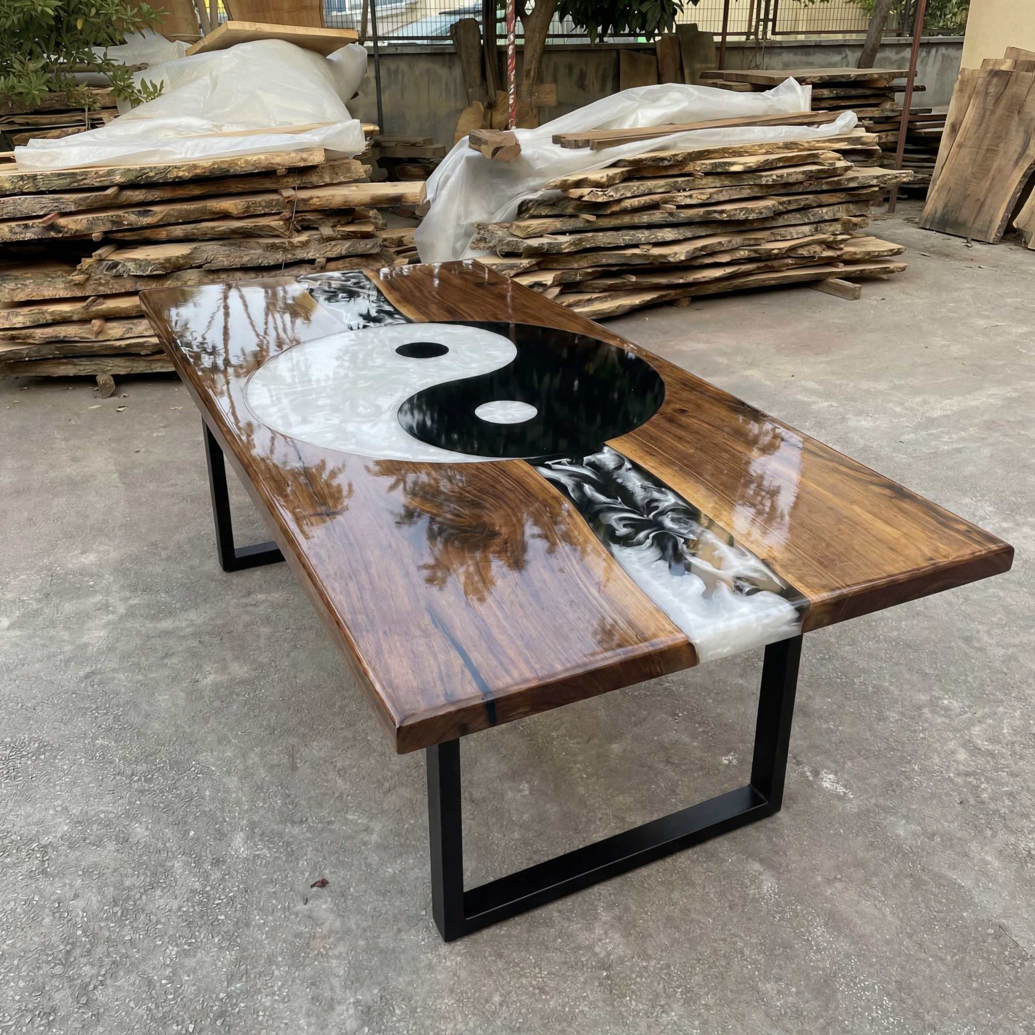Hand-poured black and white resin Yin Yang design on solid walnut dining table with mirror gloss finish