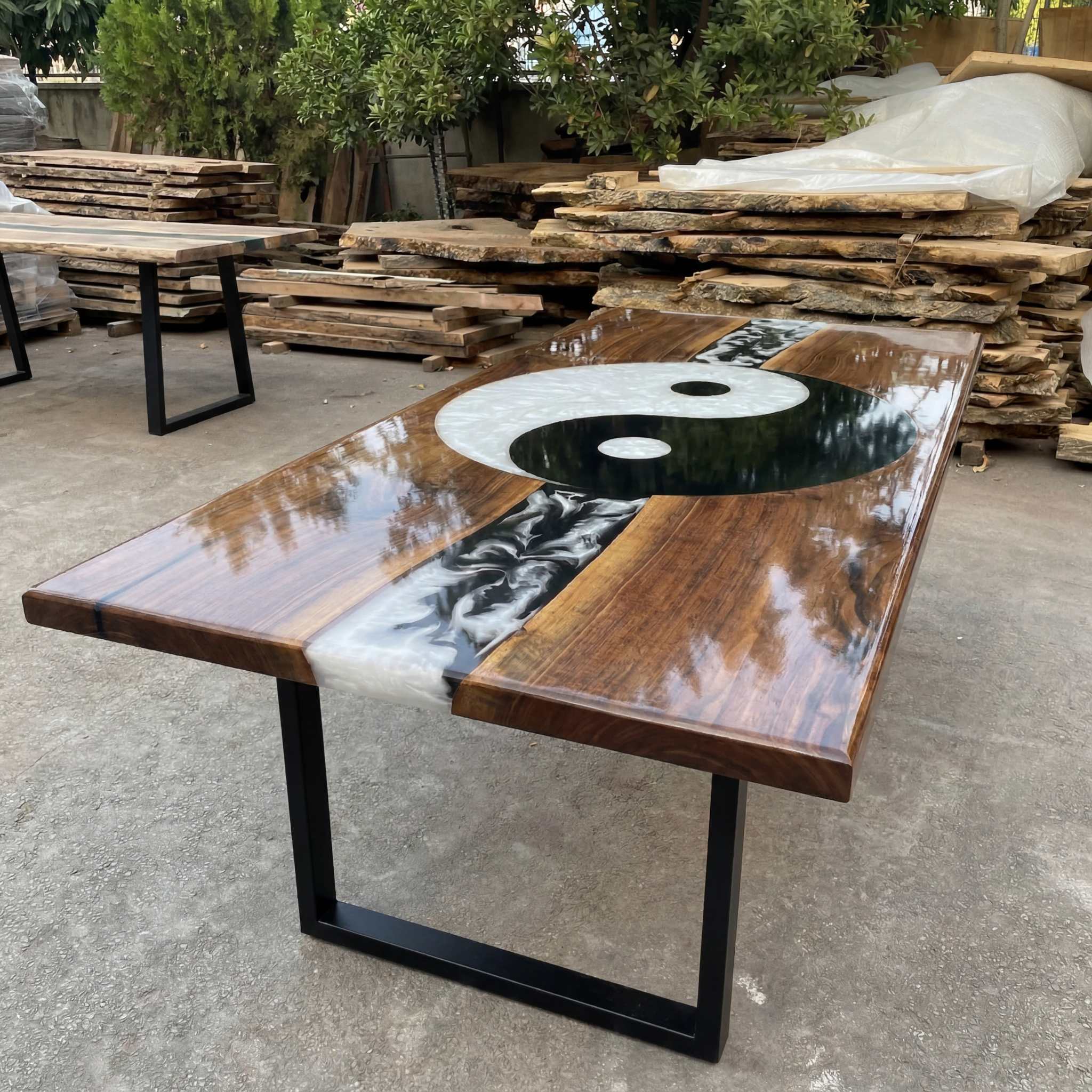 Hand-poured black and white Yin Yang resin dining table with solid walnut top and mirror gloss finish
