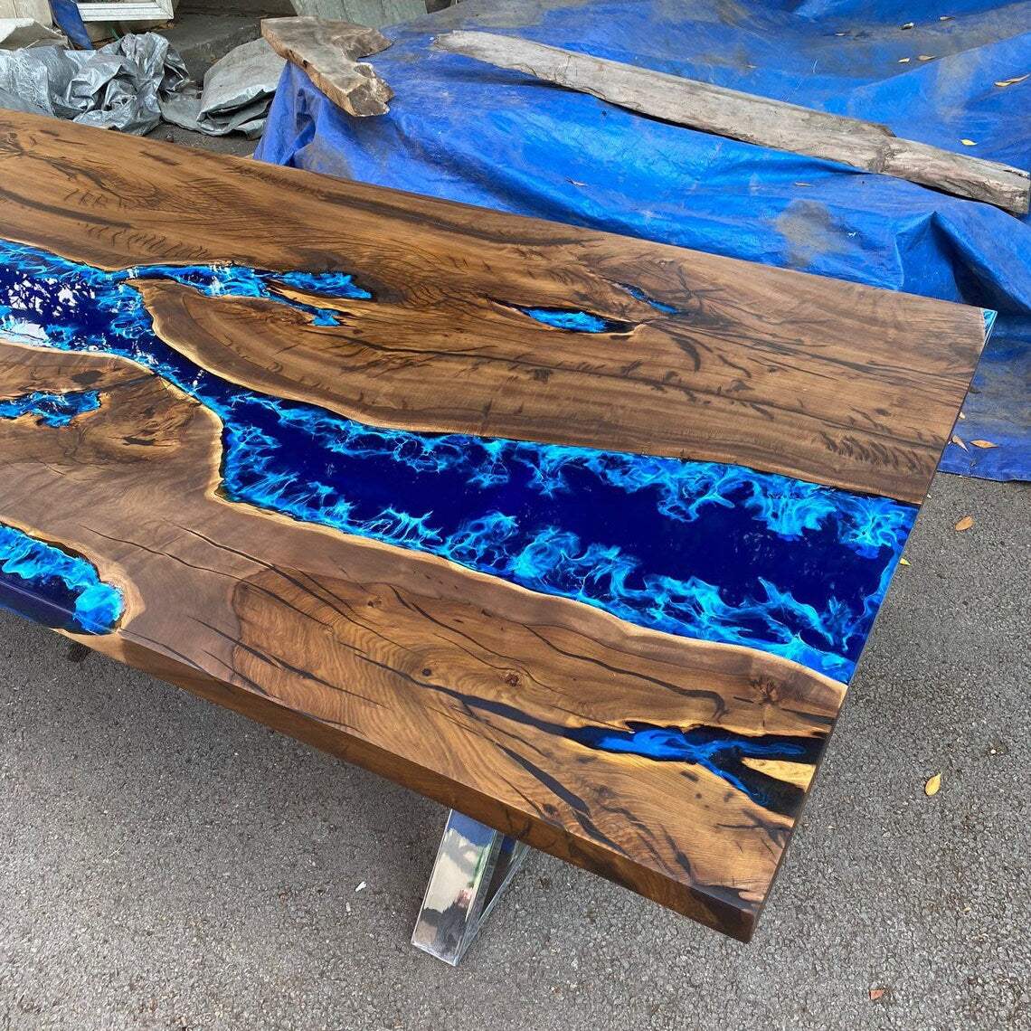 Atlantic Walnut Dining Table with deep blue epoxy river and silver geometric metal base
