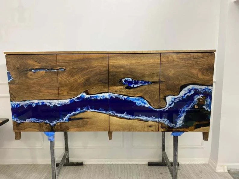 Modern Riverline Walnut Credenza with blue resin river and white wave detail on solid walnut four-door front and tapered legs