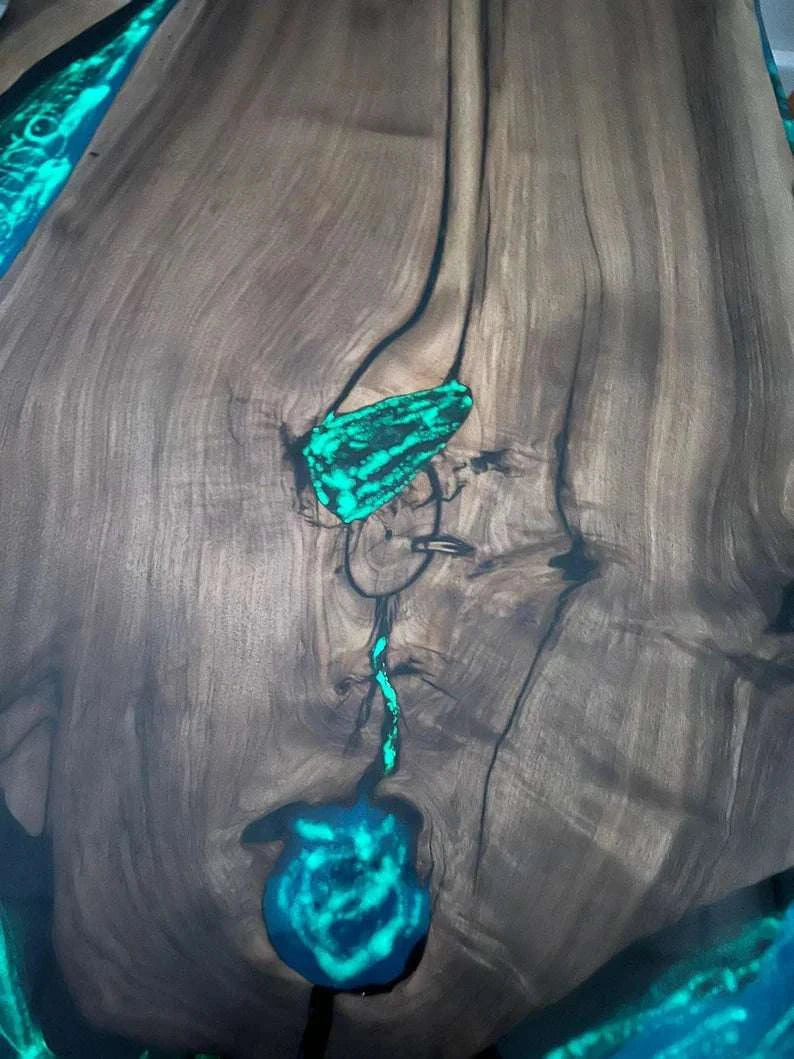 Aurora Glow Dining Table with walnut wood and glowing turquoise resin accents
