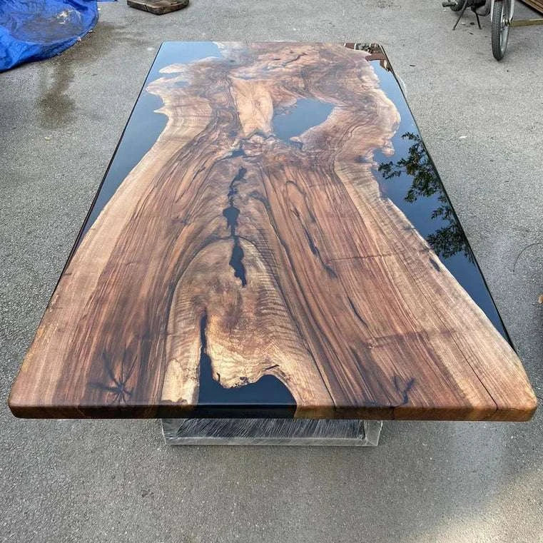 Obsidian burl dining table with walnut burl slab encased in black epoxy and silver U-shaped metal legs