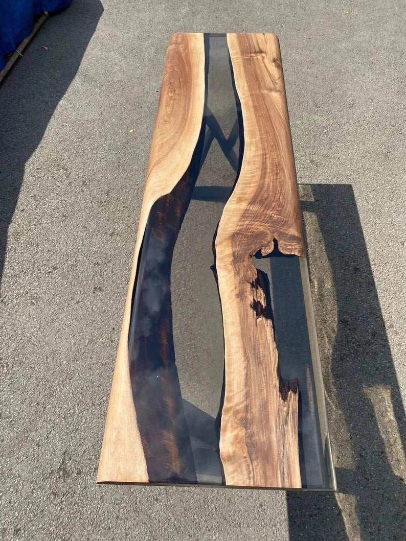 Driftwood walnut console table with glossy smoky gray resin and black metal X-shaped legs
