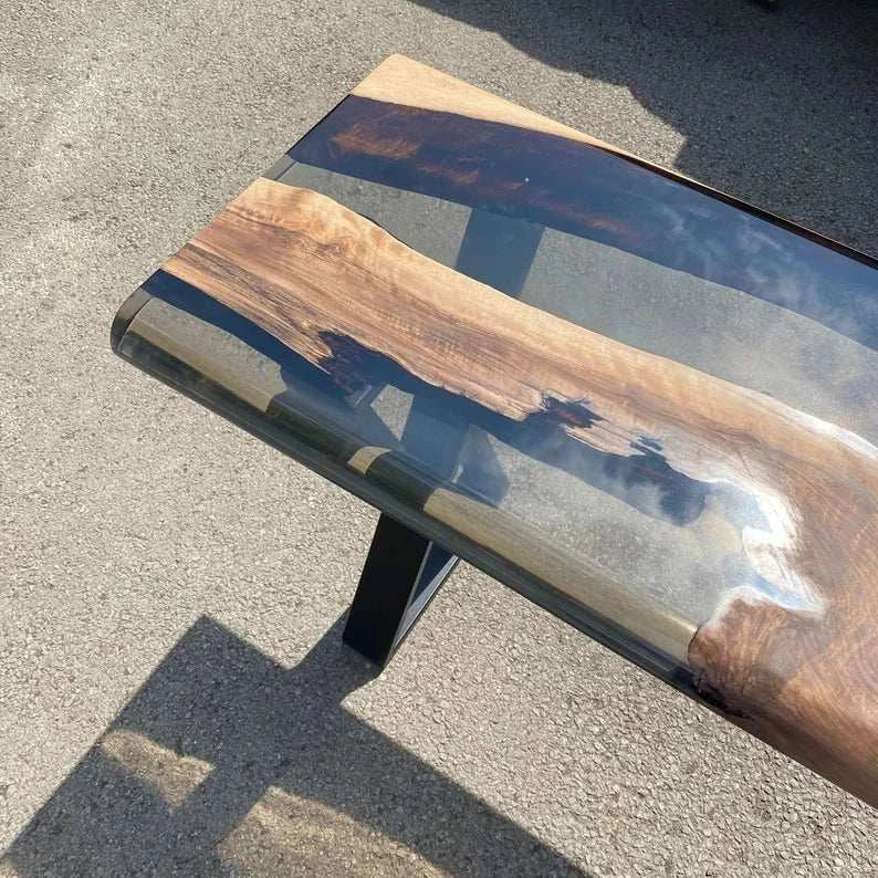 Driftwood Walnut Console Table with live-edge walnut slab and glossy smoky gray resin pour on black metal X-shaped legs