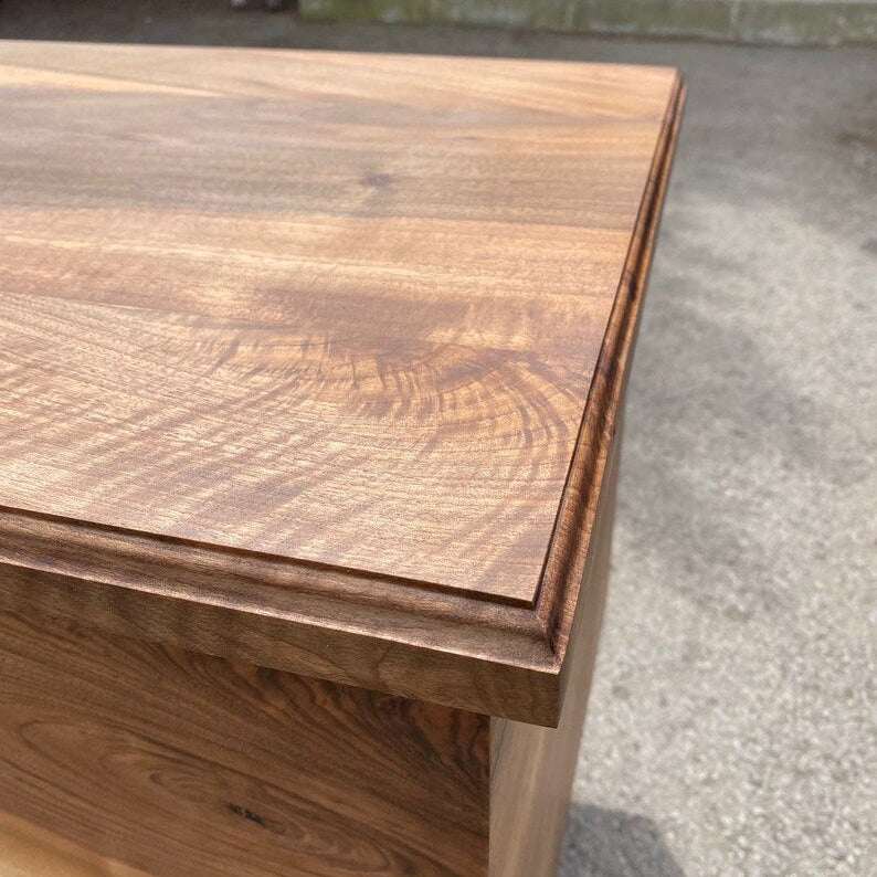 Storm Walnut Storage Bench with swirling gray resin river, solid walnut wood, and black metal legs