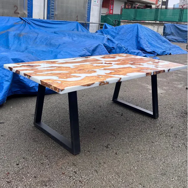 Pearl Lagoon Olive Dining Table with olive burl islands embedded in matte white epoxy top and black metal U-shaped legs