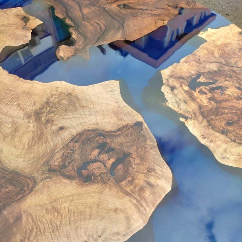 Sapphire burl round dining table with walnut burl wood and blue resin top on black metal base