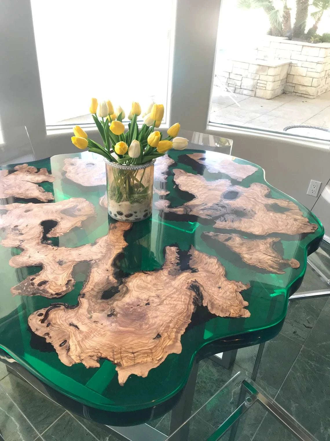 Lagoon Olive Round Dining Table with olive burl wood and turquoise resin on dark metal pedestal base