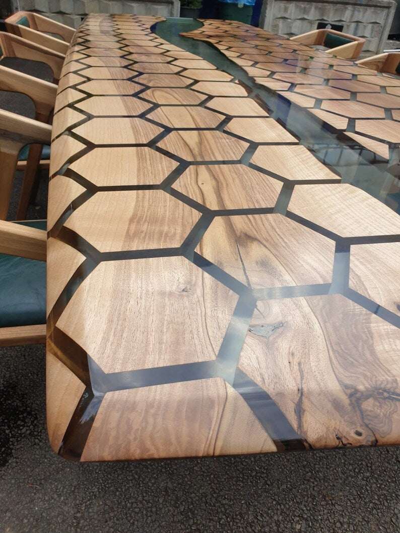 Tessellate walnut conference table with hexagon honeycomb pattern and clear resin river top