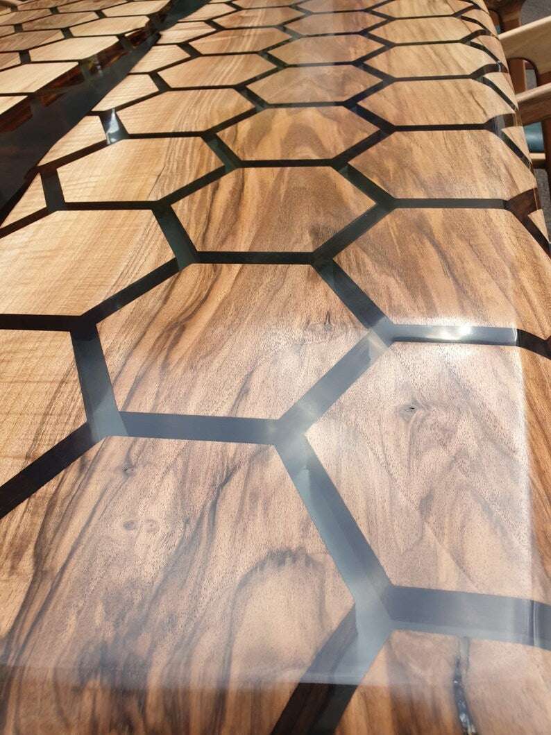 Tessellate Walnut Conference Table with hexagon honeycomb pattern and clear resin river on angled wooden legs