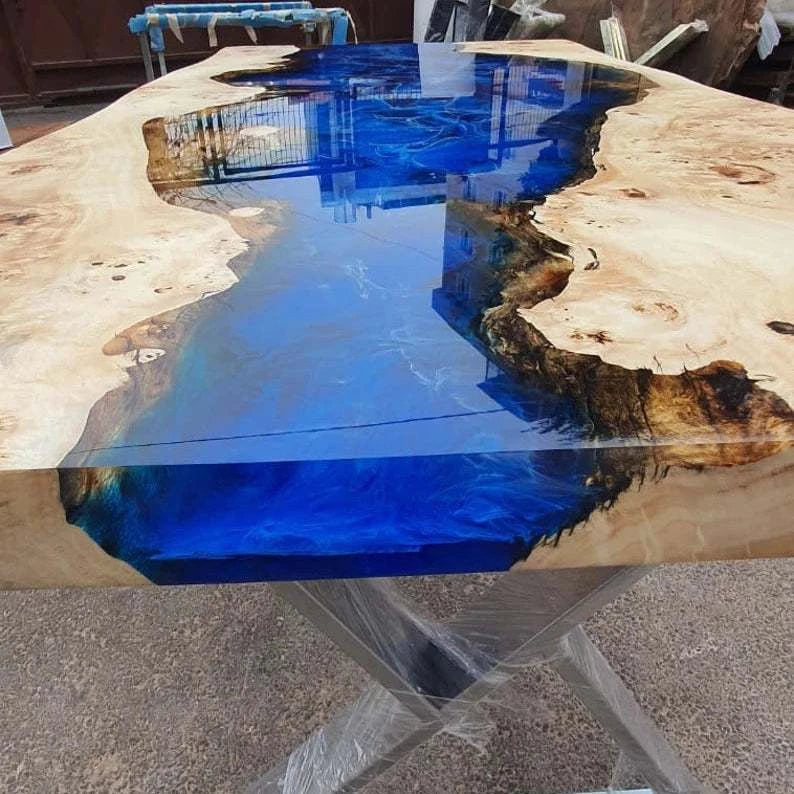Cascade Burl Dining Table with ocean blue resin river and geometric silver metal base