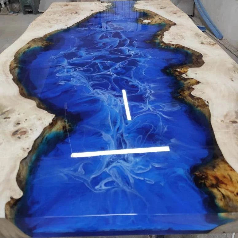Cascade Burl Dining Table with ocean blue resin river and silver geometric metal base
