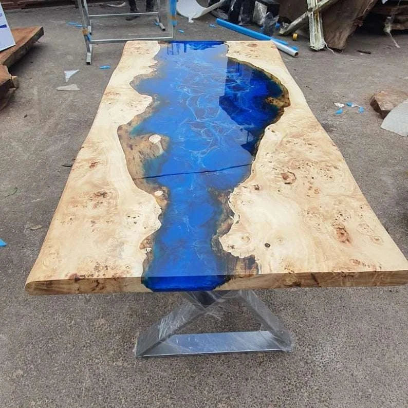 Cascade Burl Dining Table with ocean blue resin river and silver geometric metal base