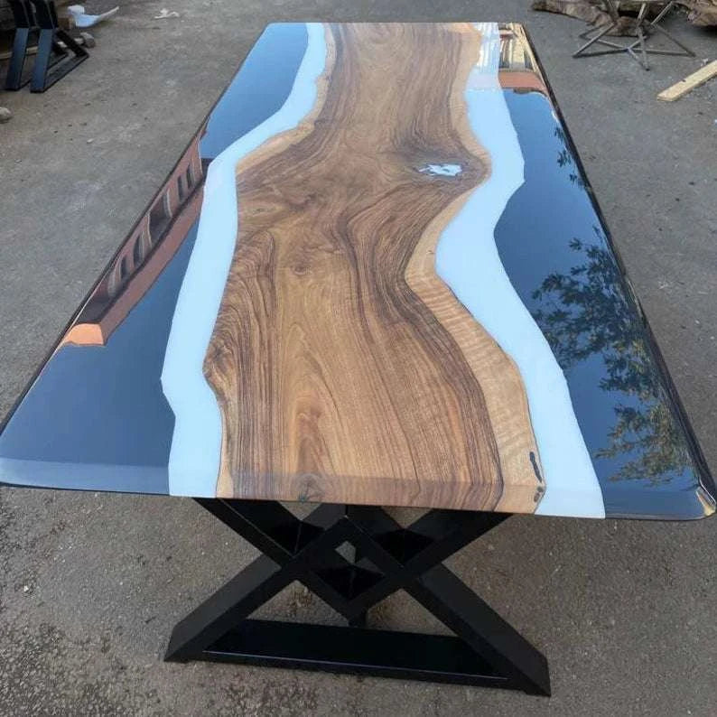 Eclipse Walnut Dining Table with three-tone walnut, white matte, and black glossy resin top and black metal X-base