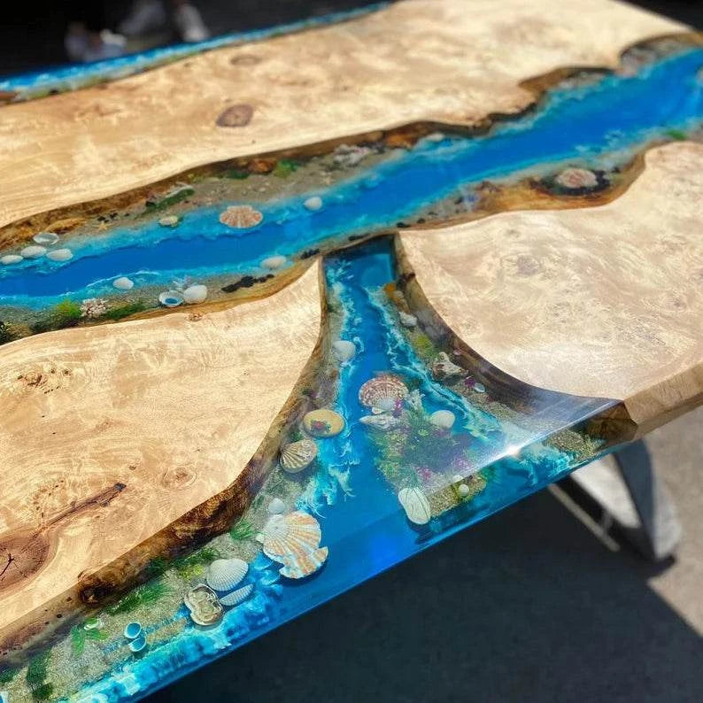 Large Archipelago Poplar Dining Table with live-edge, ocean blue resin river, miniature islands, and black metal base