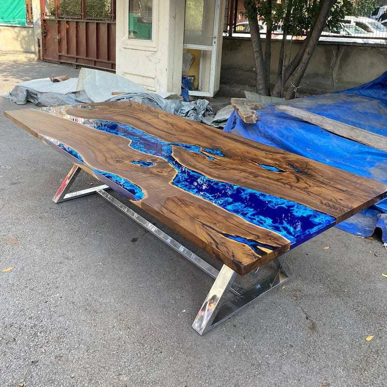 Large Atlantic walnut dining table with deep blue epoxy river and silver geometric metal base