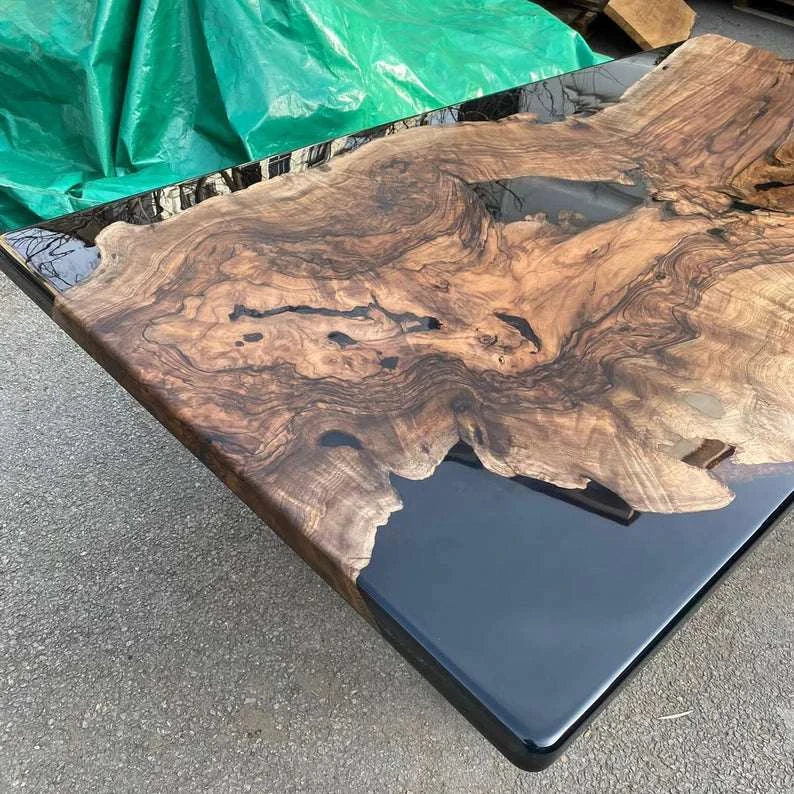 Obsidian Burl Dining Table with walnut burl slab, black epoxy resin, and silver metal legs