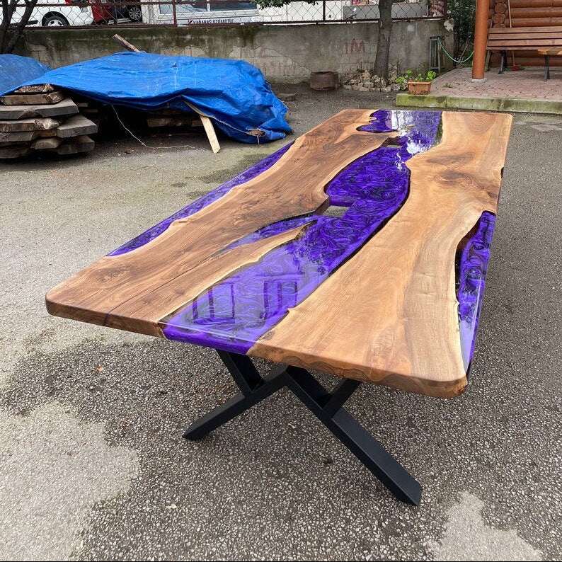 Large live-edge Amethyst River Walnut Dining Table with purple swirly resin river and black metal X-base