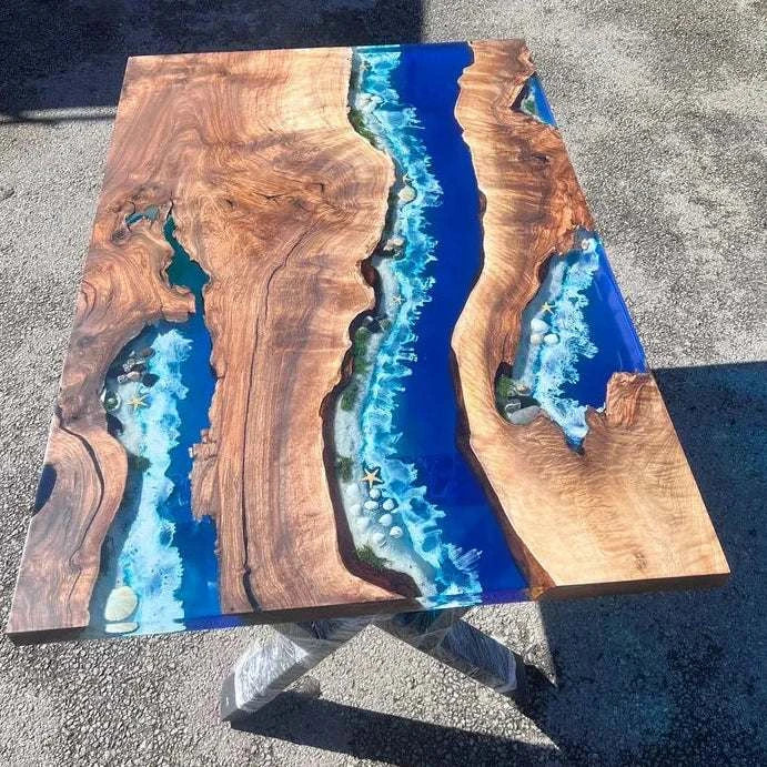 Coral Reef Live Edge Dining Table with walnut wood, blue resin river, and embedded shells on black metal base