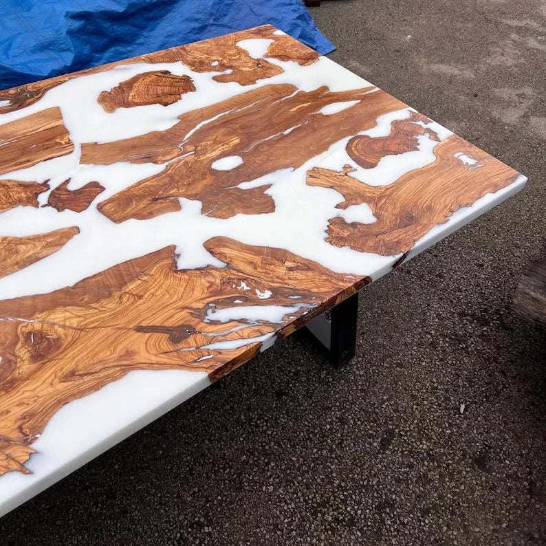 Pearl Lagoon Olive Dining Table with olive burl islands in matte white epoxy and black metal U-shaped legs