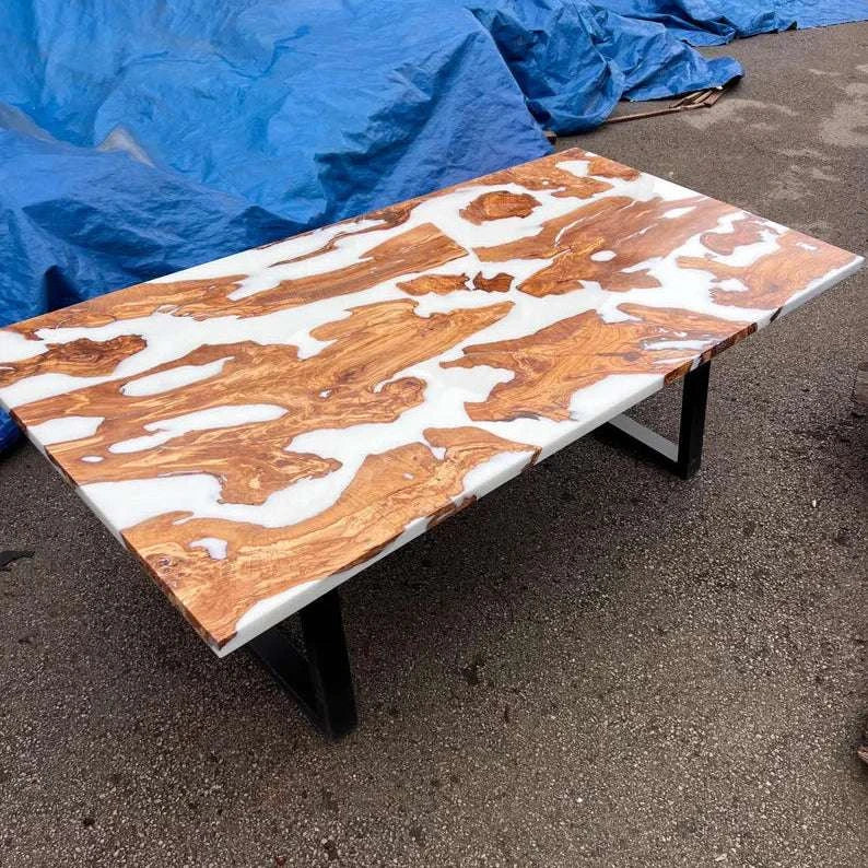 Pearl Lagoon Olive Dining Table with olive burl islands in matte white epoxy and black metal U-shaped legs