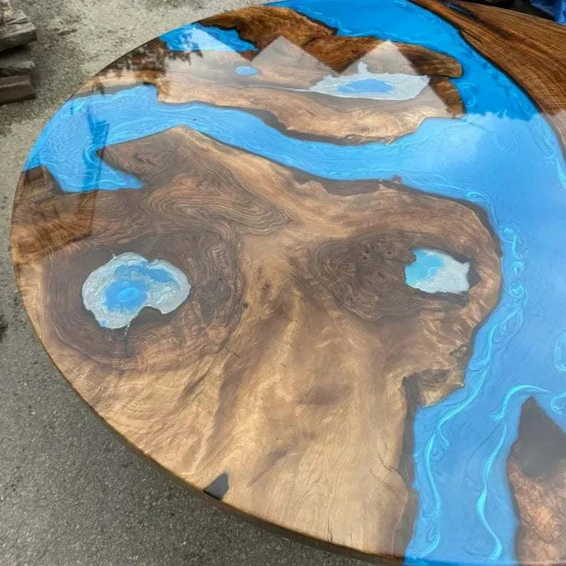 Constellation Round Dining Table with walnut wood, metallic blue resin channels, and geometric black steel base