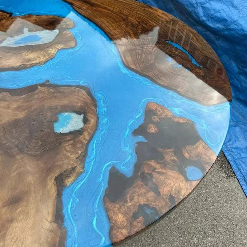 Constellation Round Dining Table with walnut wood and metallic blue resin channels on geometric black steel base